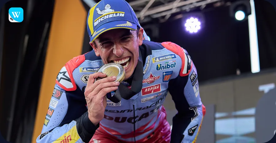 Marc Márquez biting his medal